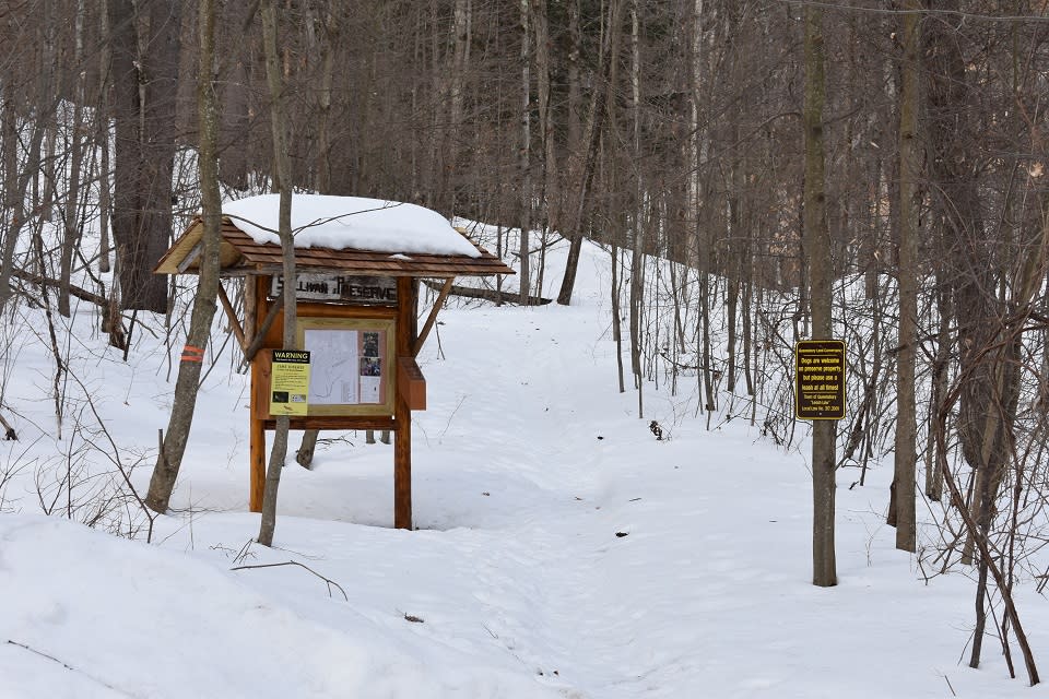 the Sullivan Preserve welcome sign at the trailhead in winter