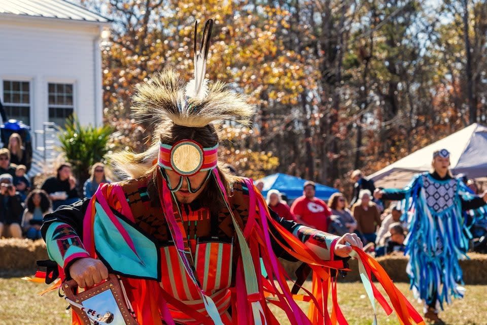 A man in traditional Catawba clothing, dancing