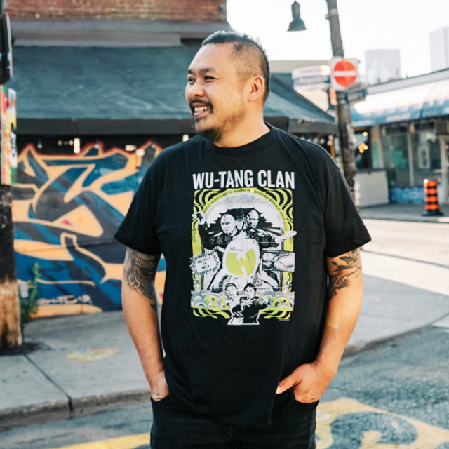 Trevor Lui standing in Kensington Market in Toronto