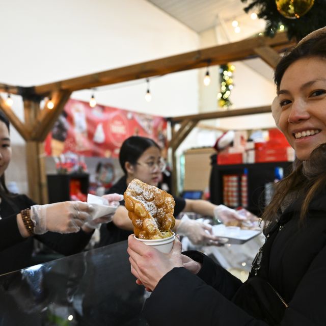 Women being served a treat at Canada's Wonderland Winterfest