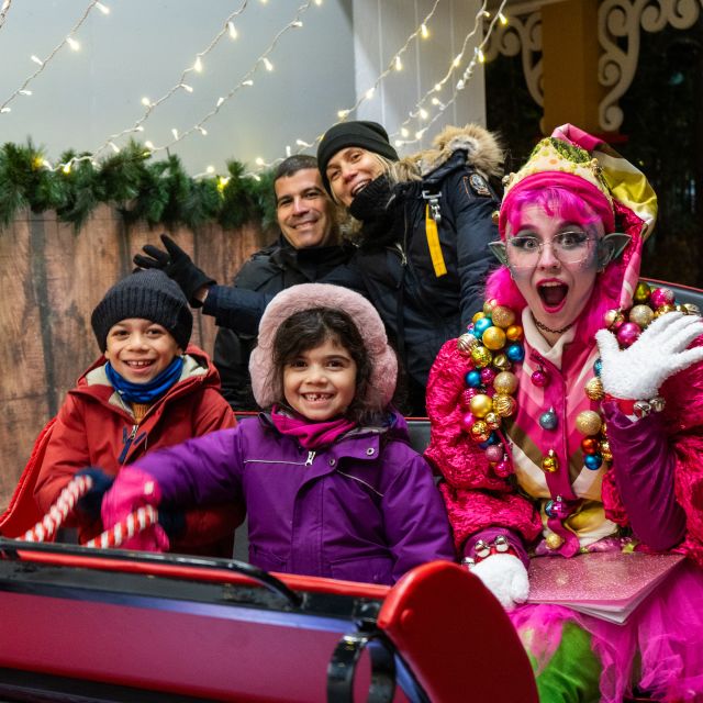 Family posing with character at Canada's Wonderland Winterfest