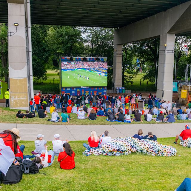 Fans sitting under the Bentway at FIFA Fan Festival to watch the FIFA World Cup 2026 match in Toronto