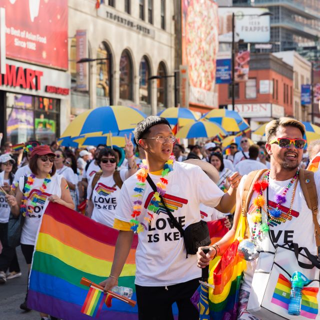 Attendees marching during Pride parade