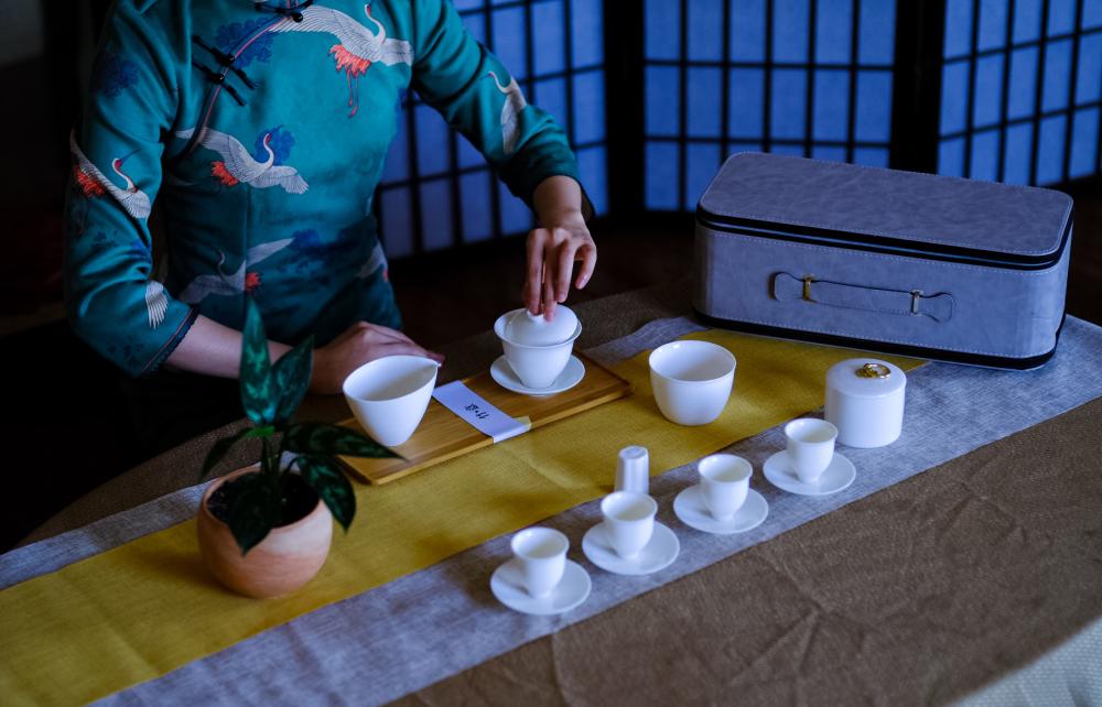 Woman making tea at West China Tea House in Austin Texas