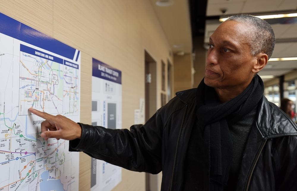 TheRide person points to map