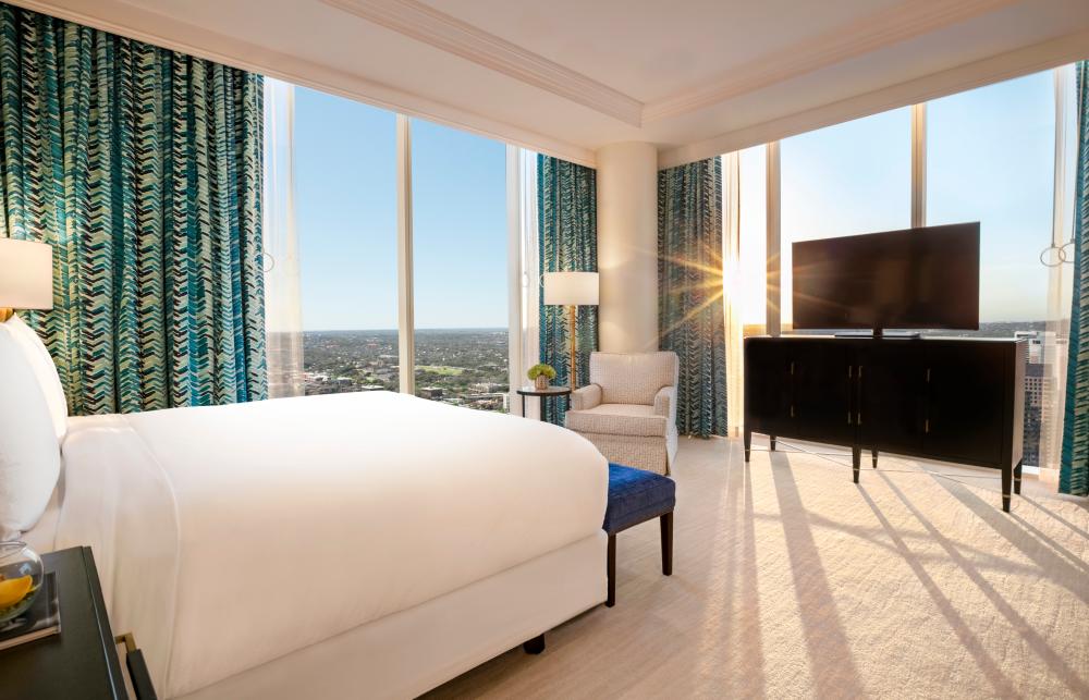 Bed and windows in the Presidential Suite at Fairmont hotel in Austin Texas