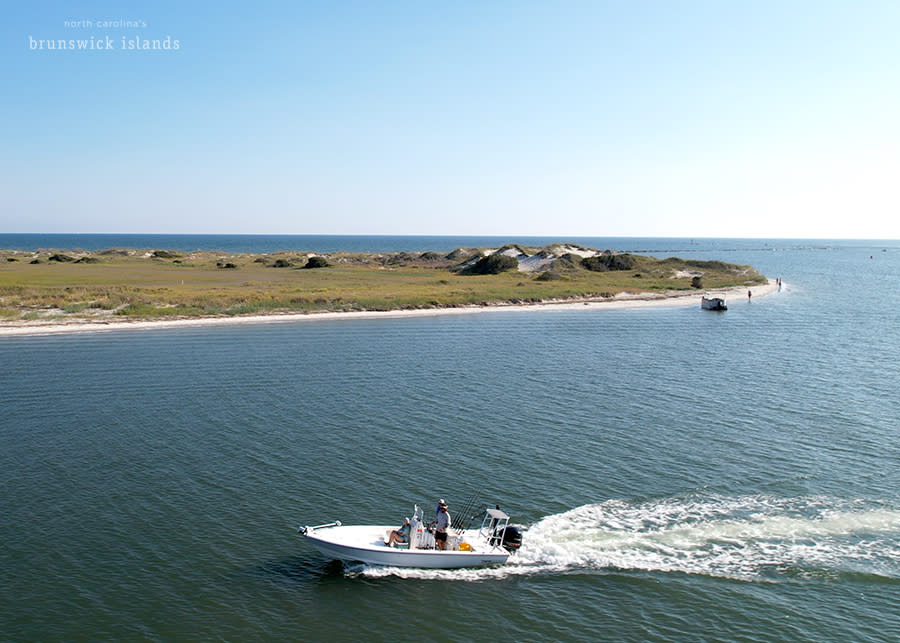 a boat traveling behind bird island