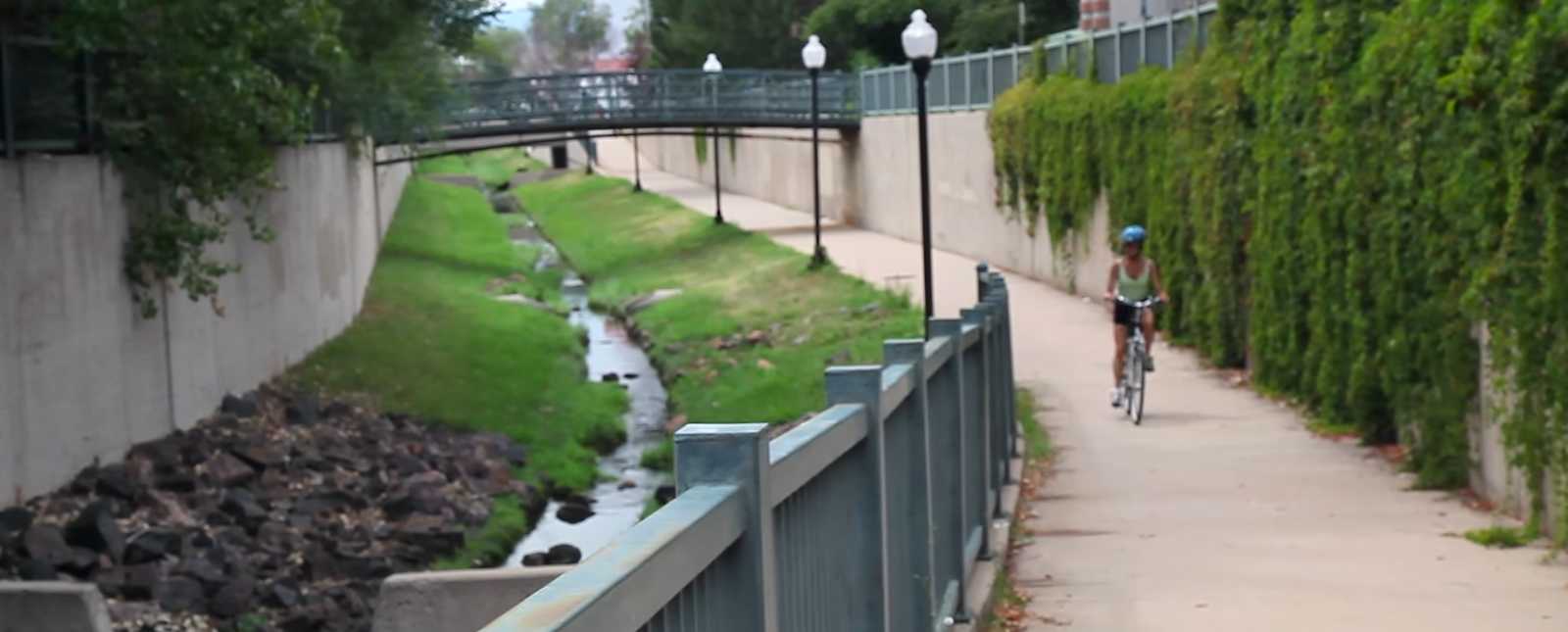 Bicycle rider on bike path in Littleton