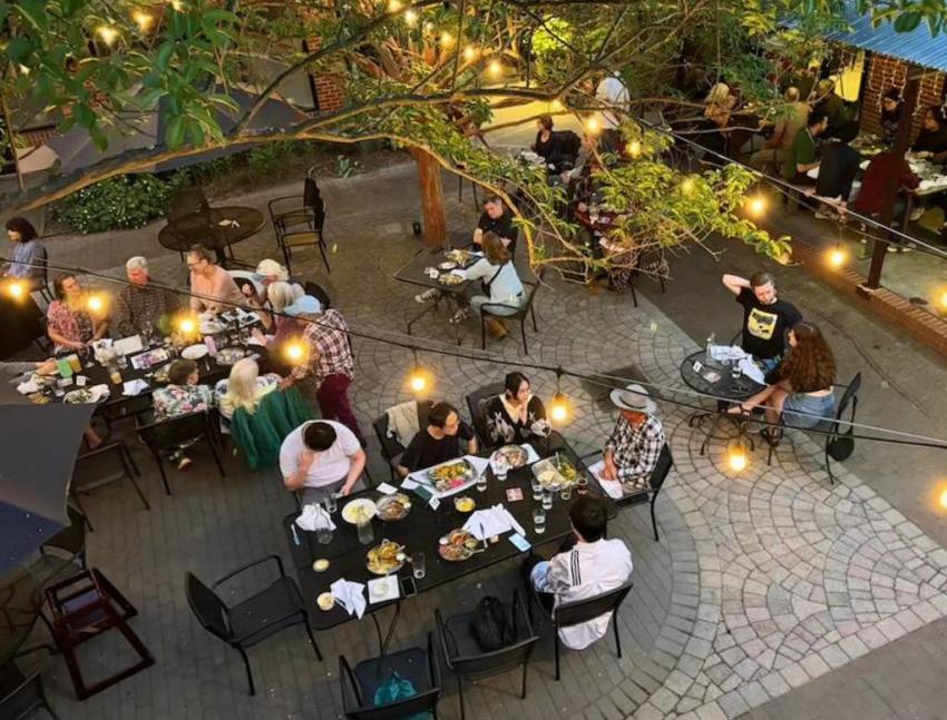 People Dining in the Courtyard at Vimala's Curry Blossom