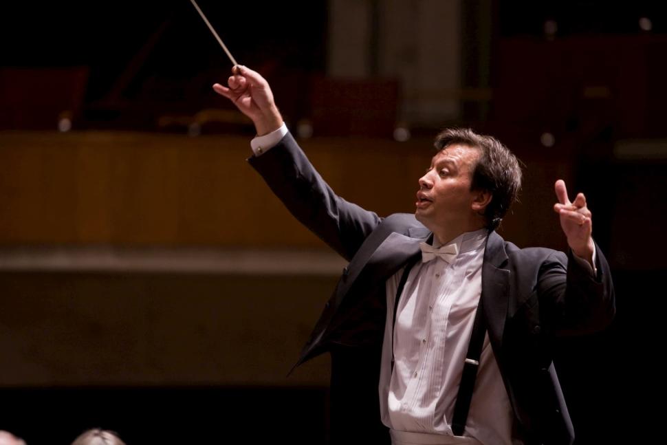 A conductor works with the Wichita Symphony Orchestra