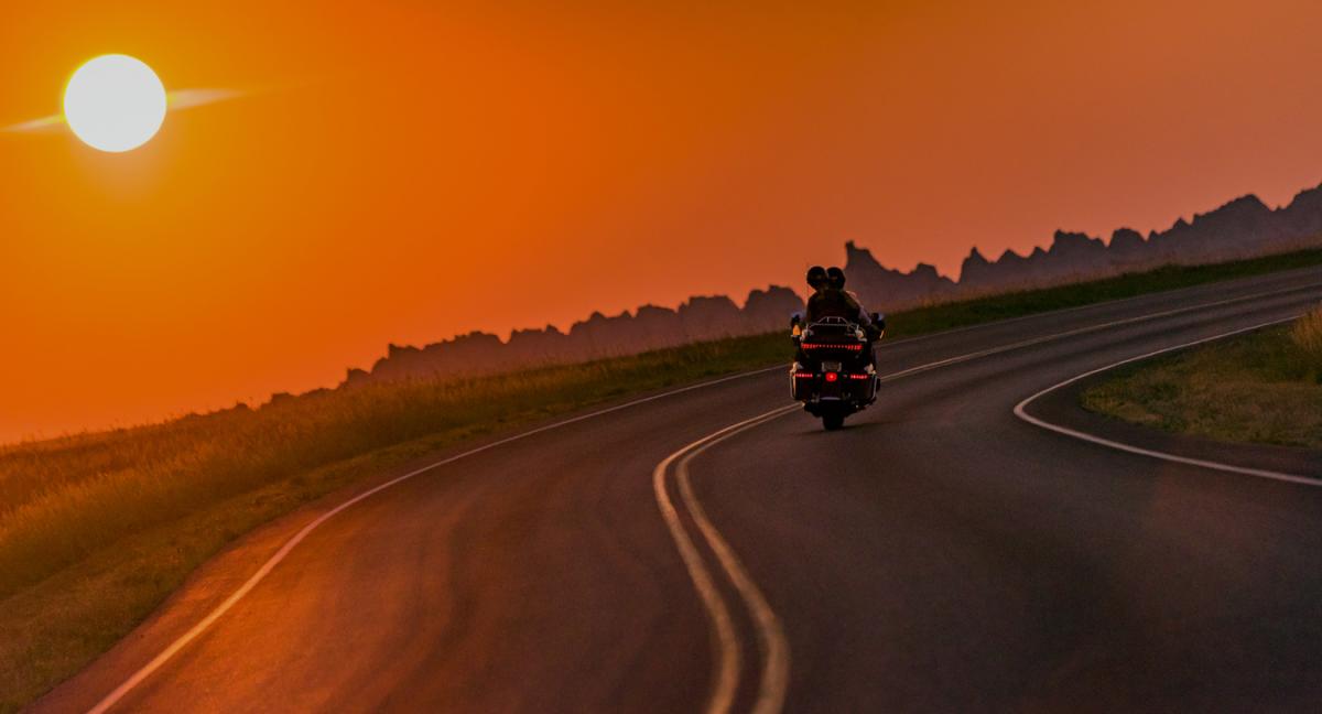 Motorcycle riding in the sunset