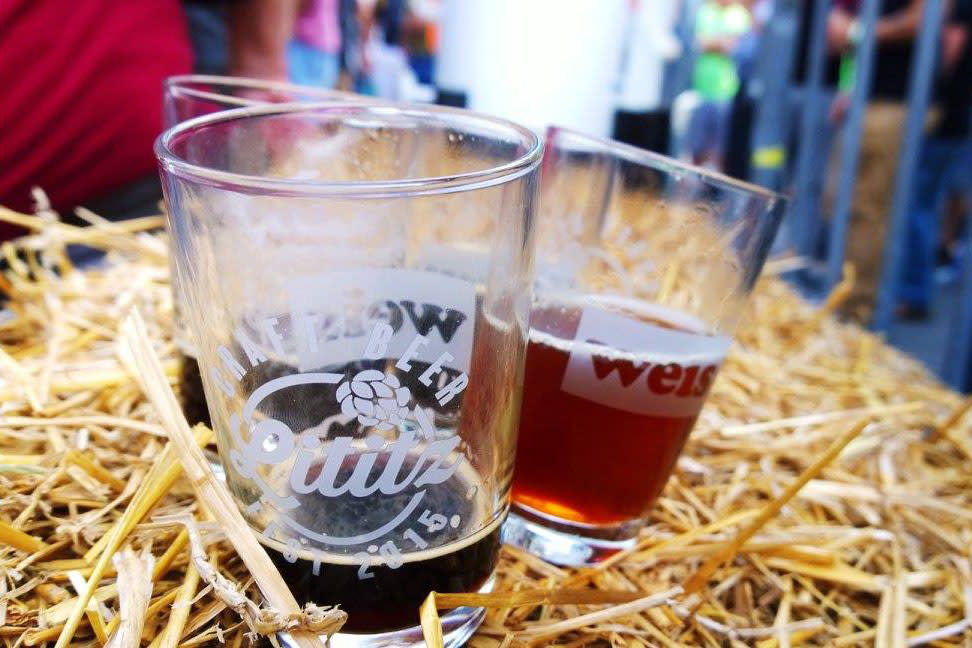 Beer pour glasses placed on Hay stack