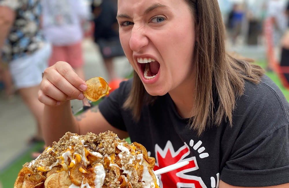 Glier's Goettafest Girl Eating Nachos Crop