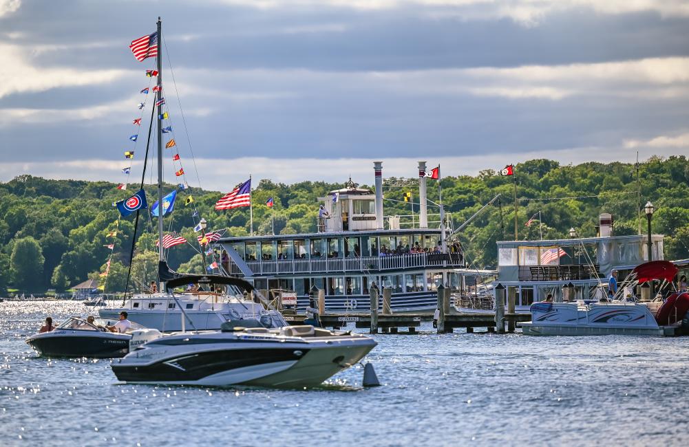 Cruise line boats and sailboats in the harbor