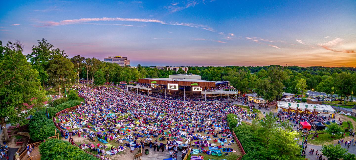 This picture of the Merriweather Post Pavilion shows an outdoor venue packed with music lovers
