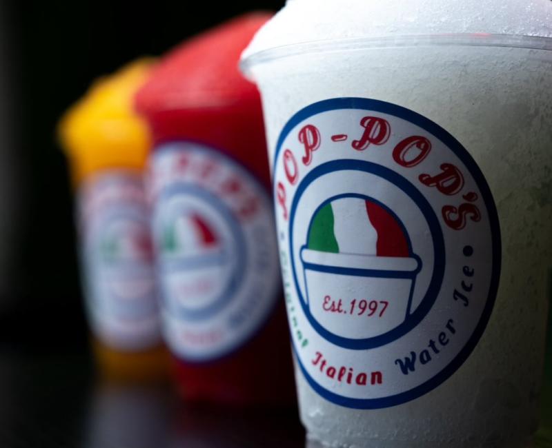Three cups of Italian ice on a black background from Pop Pop's Italian Ice