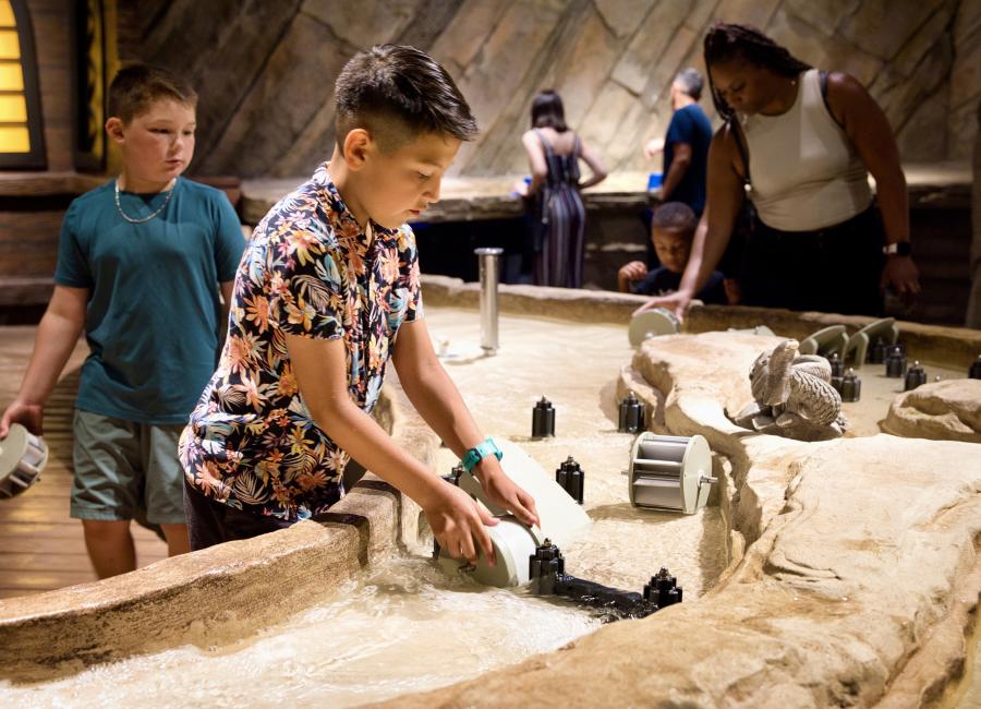 Two boys experimenting with water at Science Museum Oklahoma.