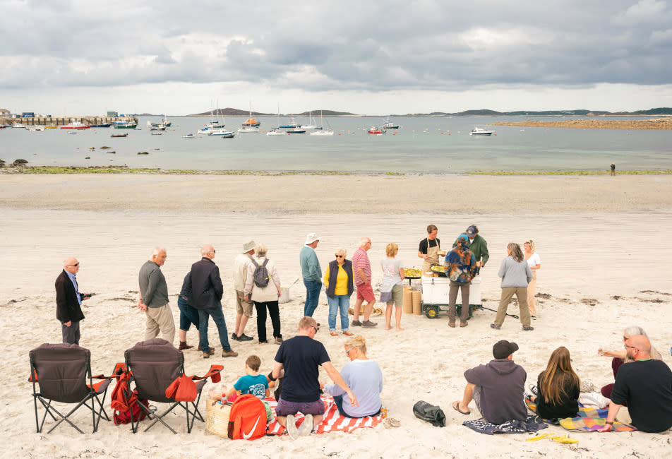 IOS Nav Landscape Large - F&D - Taste of Scilly - Simon Stallard - St Mary's people on beach 952x650