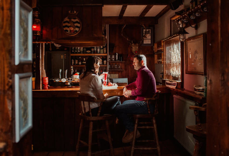 IOS Nav Landscape Large - Winter - Tresco - couple at bar New Inn 952x650