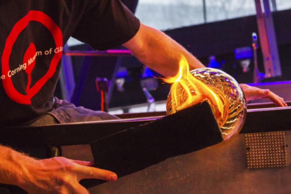Corning Museum of Glass - Glass Blowing -Courtesy The Corning Museum of Glass A glassblower shaping glass at the Corning Museum of Glass