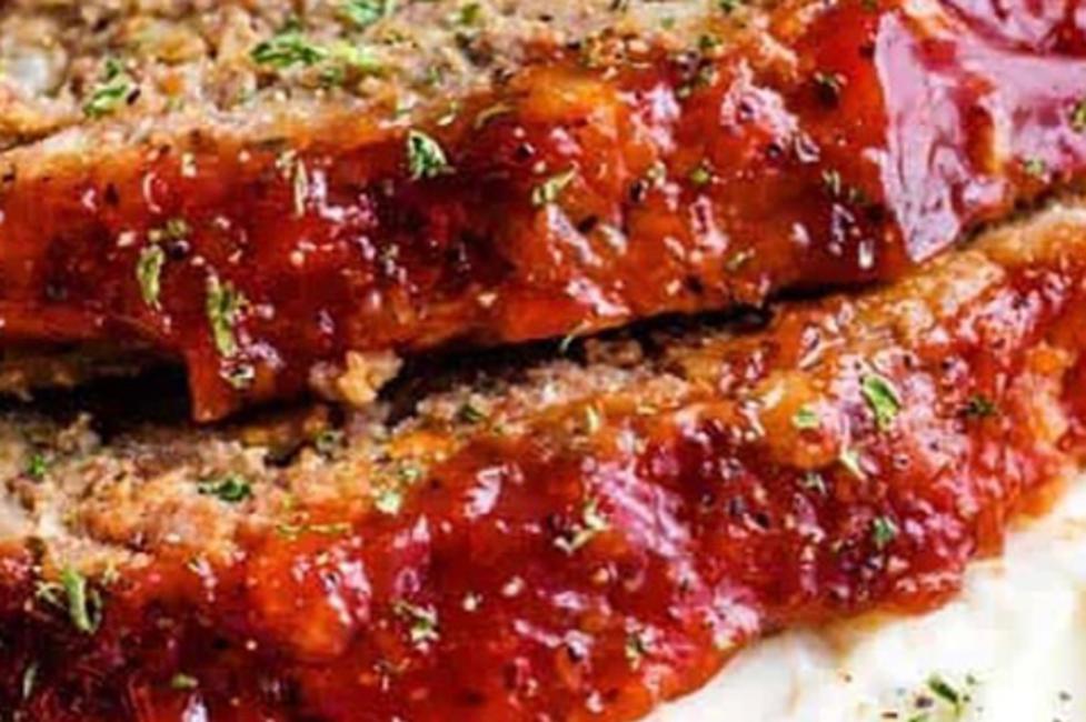 Meatloaf two slices of meatloaf on top of mashed potatoes