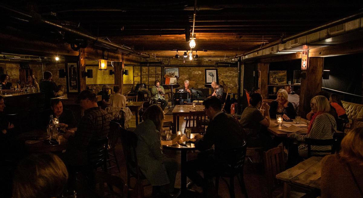 live music and people enjoying the secretive space of the Blind Lion speakeasy in rapid city south dakota