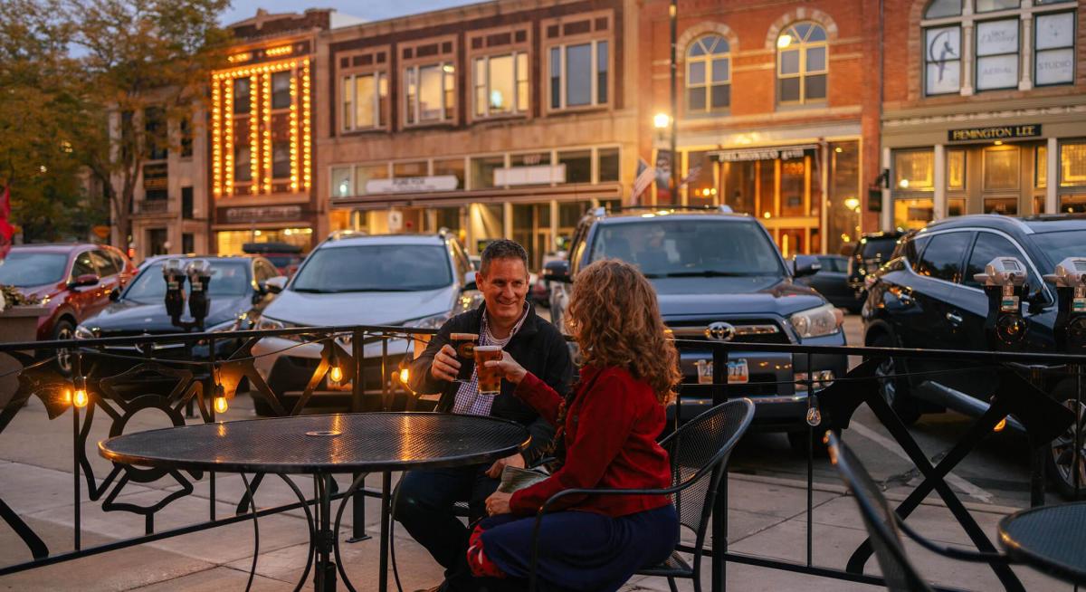 couple enjoying beers on the patio of firehouse brewing company in downtown rapid city south dakota