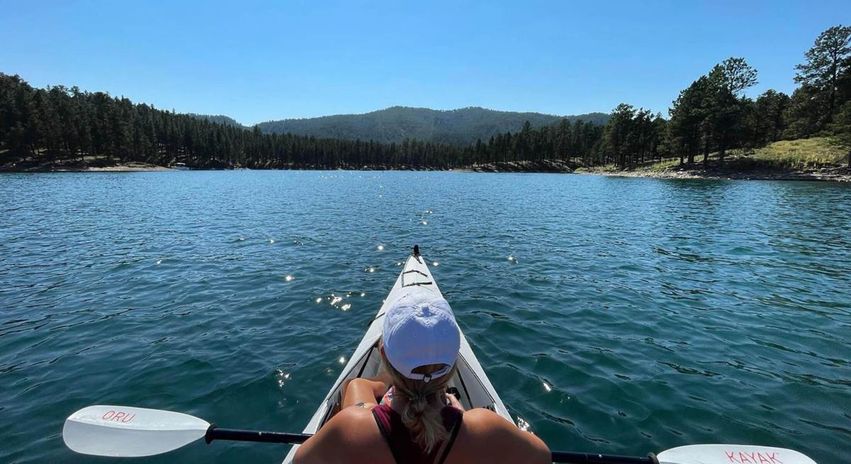 kayaker on the waters of the mountain lake Pactola in the black hills of south dakota
