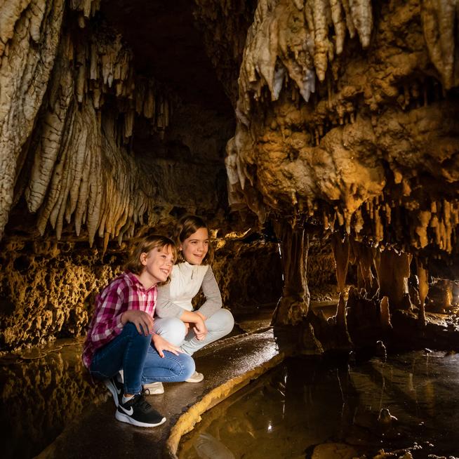 Two girls inside Cave of the Mounds