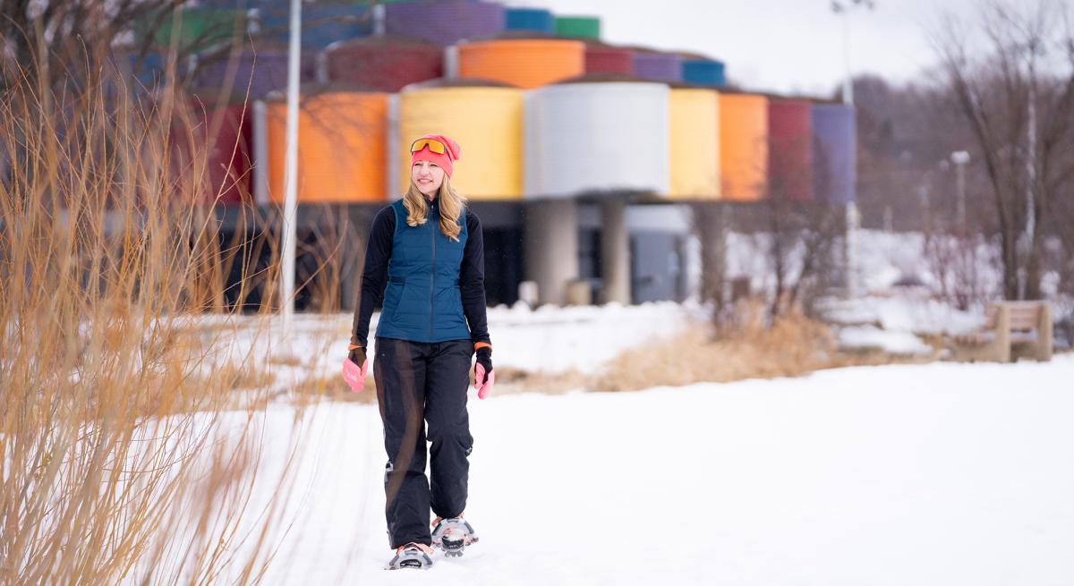 A woman snowshoes on the trails at Warner Park