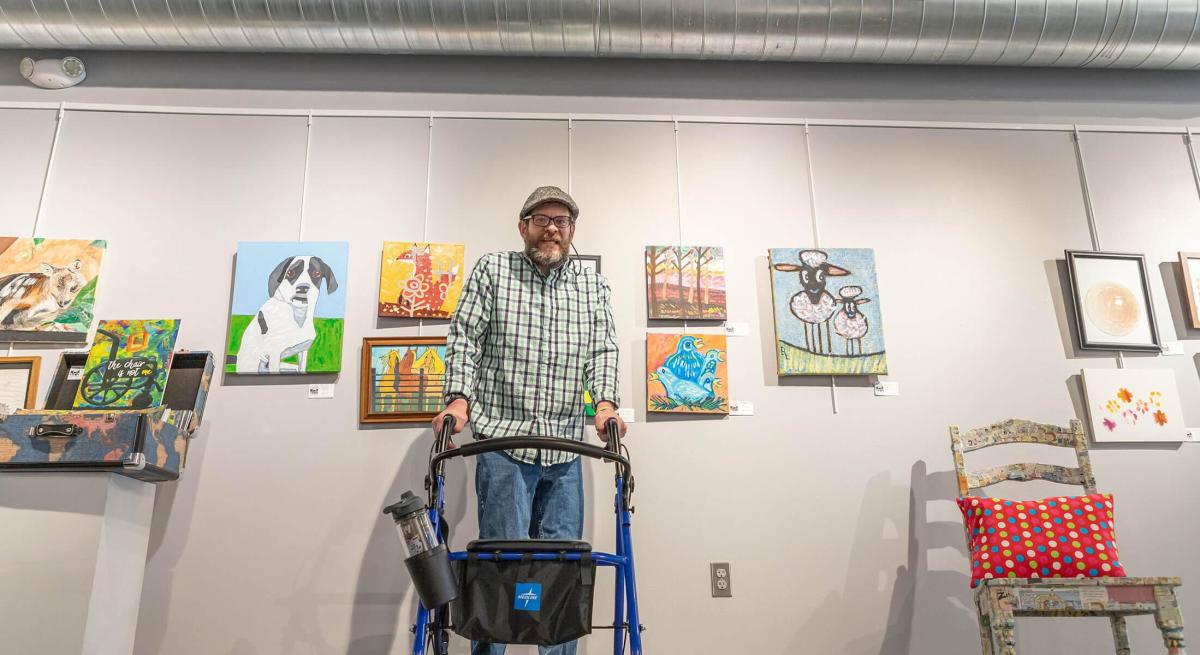 Bob Lew in front of his artwork in the Suzie Cappa Art Center