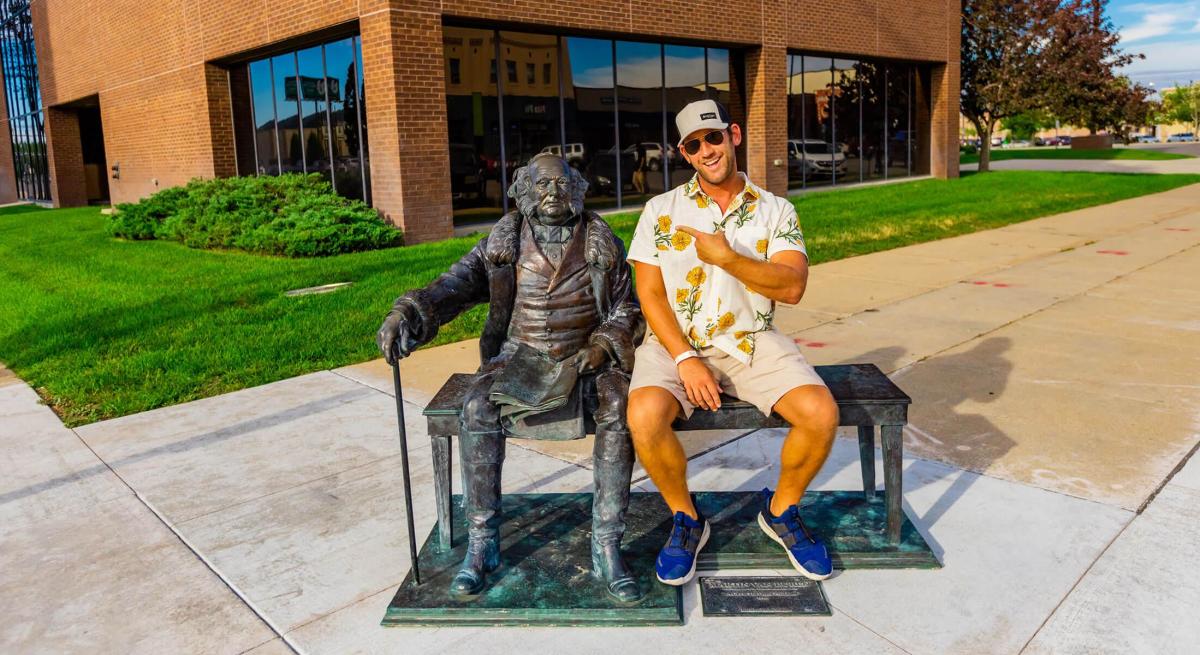 Man sitting on bench with Martin Van Buren in Rapid City, SD