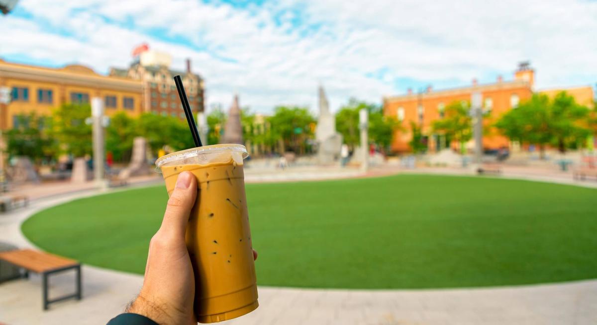 Iced coffee from Alternative Fuel with Main Street Square in the background