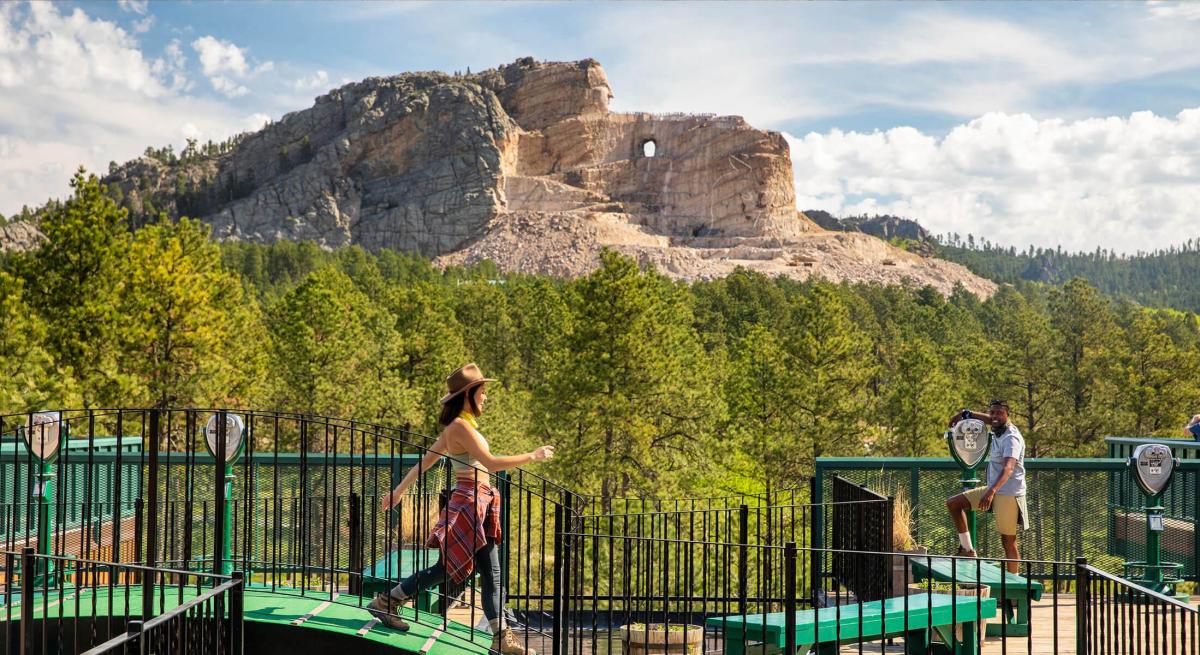 Visitors taking in the view of the crazy horse carving from the visitor center