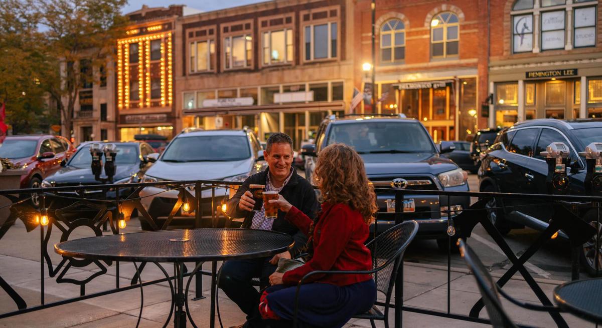 couple enjoying beers on the patio of firehouse brewing company in downtown rapid city south dakota