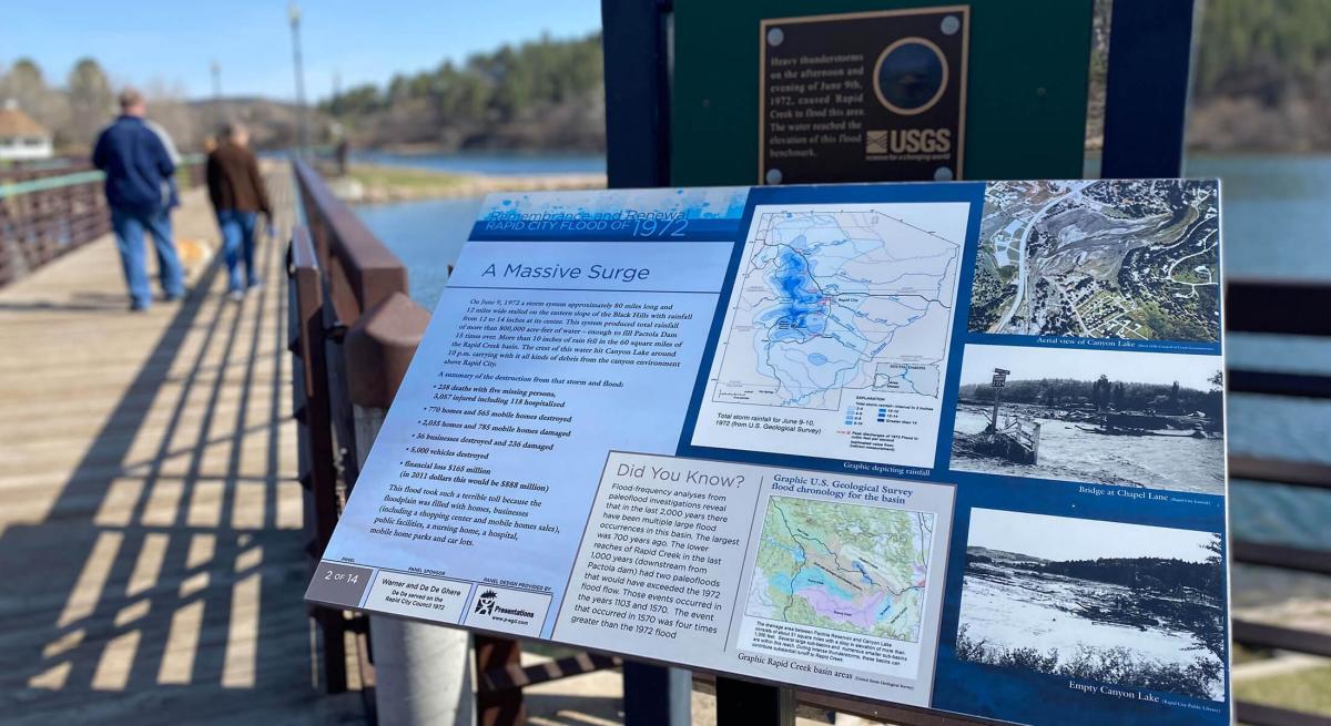 Flood marker with historic information at Canyon Lake Park in Rapid City, SD