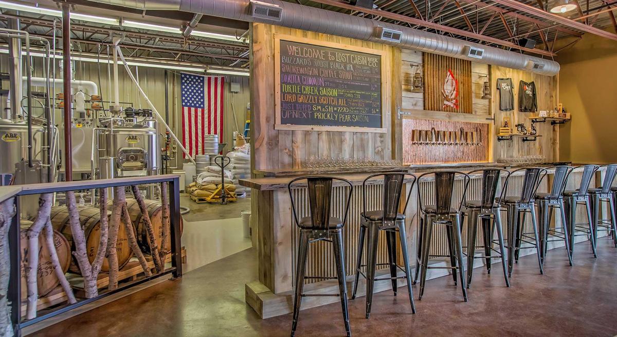 View of taps, chairs and menu in Lost Cabin Beer Co in Rapid City