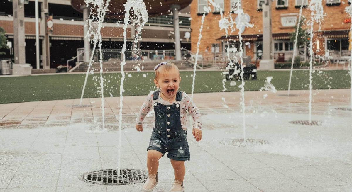 Child Playing in the Fountains at Main Street Square