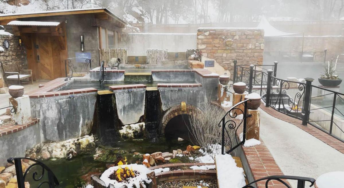 Snow and steam surrounding the natural pools of Moccasin Springs in hot springs south dakota