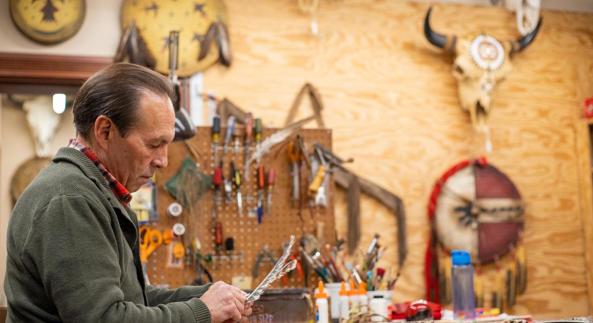 artist dan chapman working at Prairie Edge Trading Company in Rapid City, SD