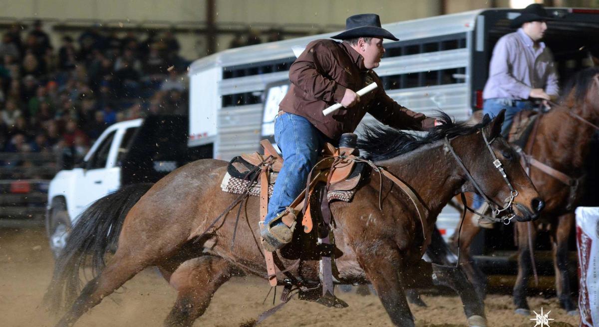 Cowboy riding a horse during a Black Hills Stock Show® event