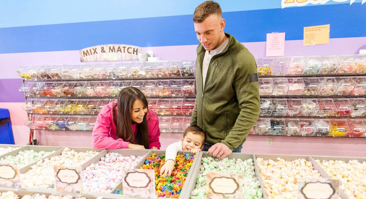 family shopping candy selection at rushmore candy company in rapid city