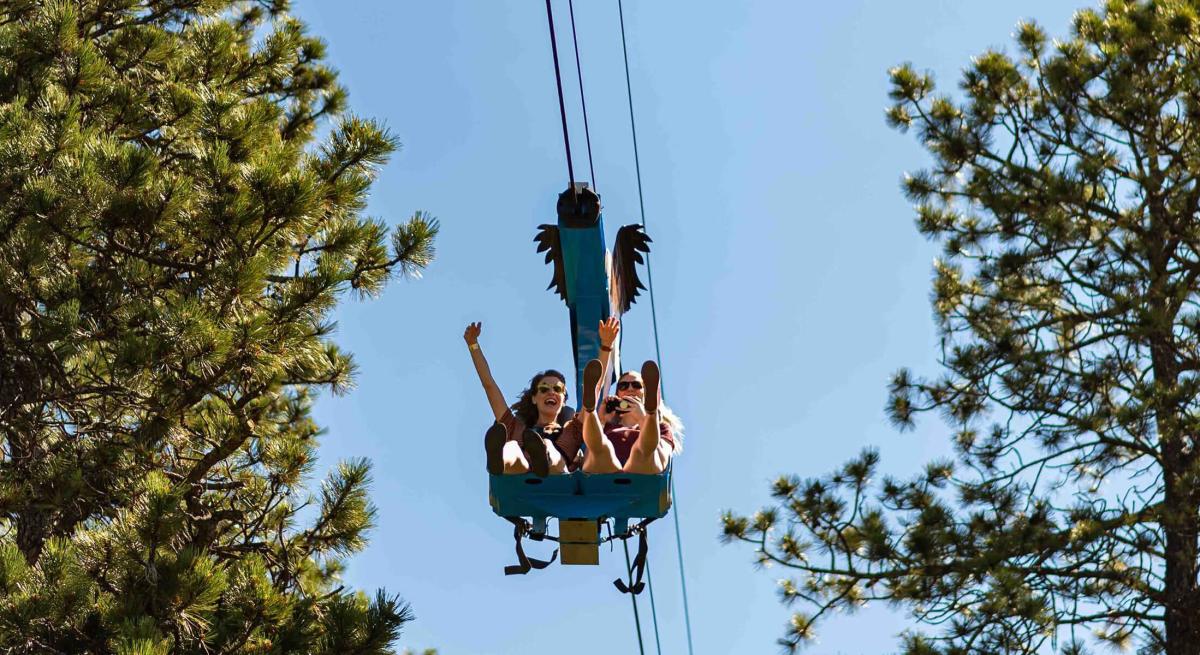 Visitors on the Soaring Eagle Zipride at Rush Mountain Adventure Park