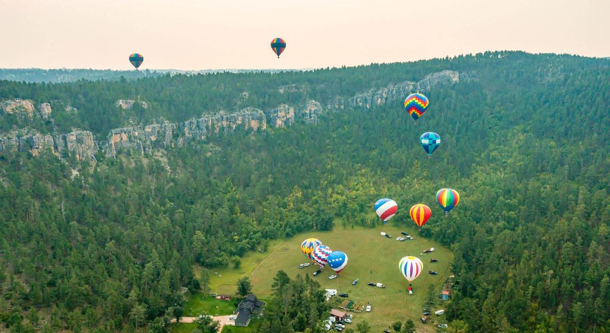 drone shot of all the hot air balloons launching from the stratobowl in south dakota during the stratobowl event