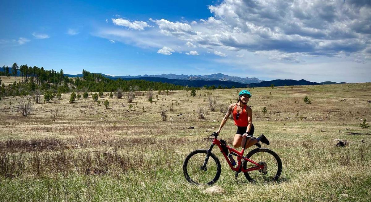 Biker with the Black Hills Behind Her