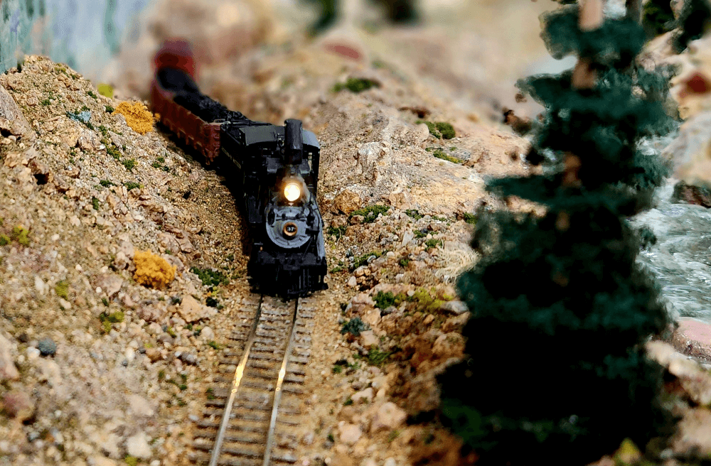 A toy train chugging through the snow at the Cheyenne Depot Museum on a snowy day.