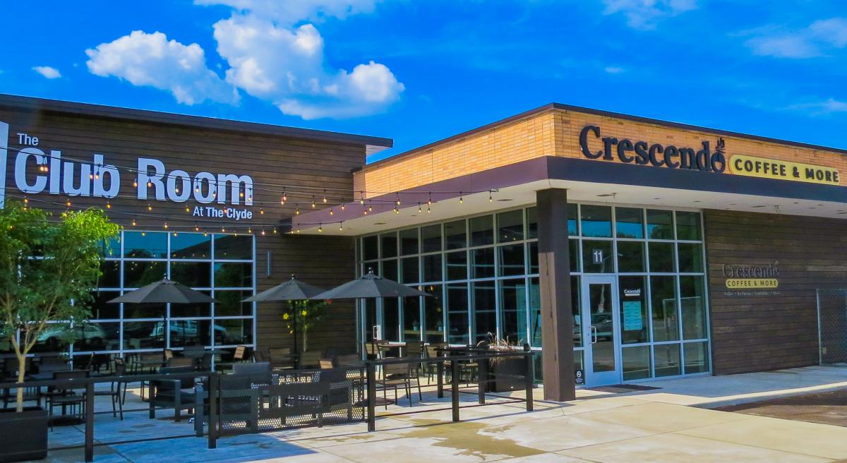 Exterior view of Crescendo Coffee Shop and outdoor dining patio