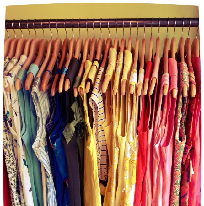Colorful vintage dresses hanging up at Smartypants Vintage