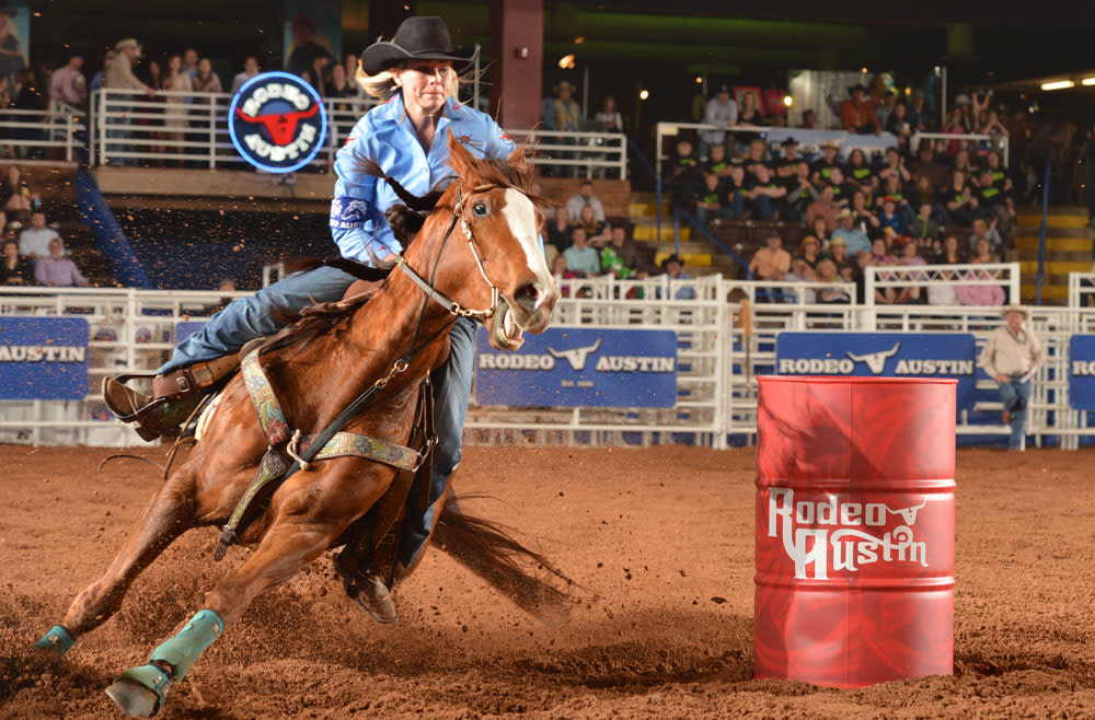 Woman competing in the barrel racing event at Rodeo Austin