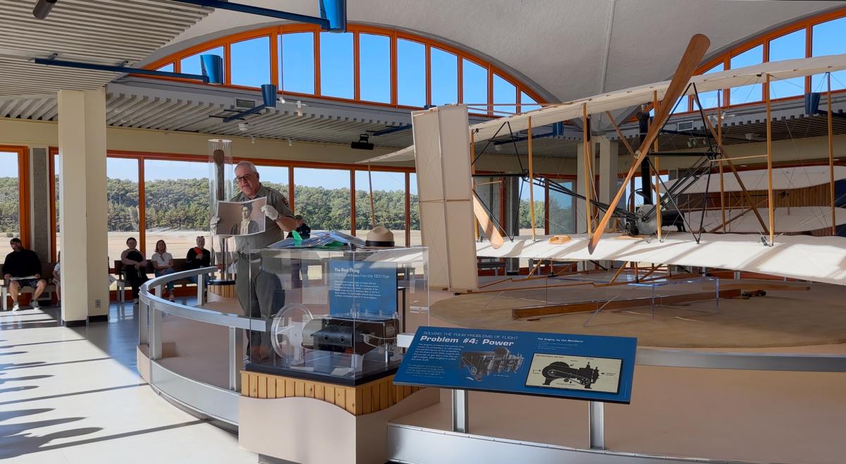 A park ranger gives a tour inside of the Wright Brothers Museum.
